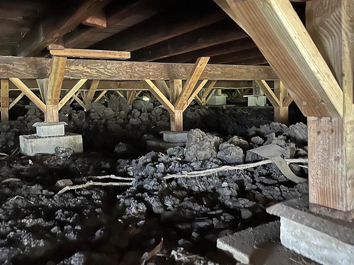 Structural Systems Hawaii technician installing grouting equipment for expansive clay soil stabilization.
