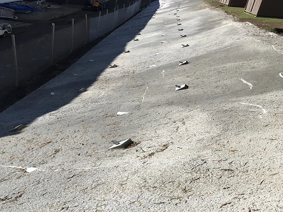 Structural Systems Hawaii slope stabilization system with soil anchors on graded hillside